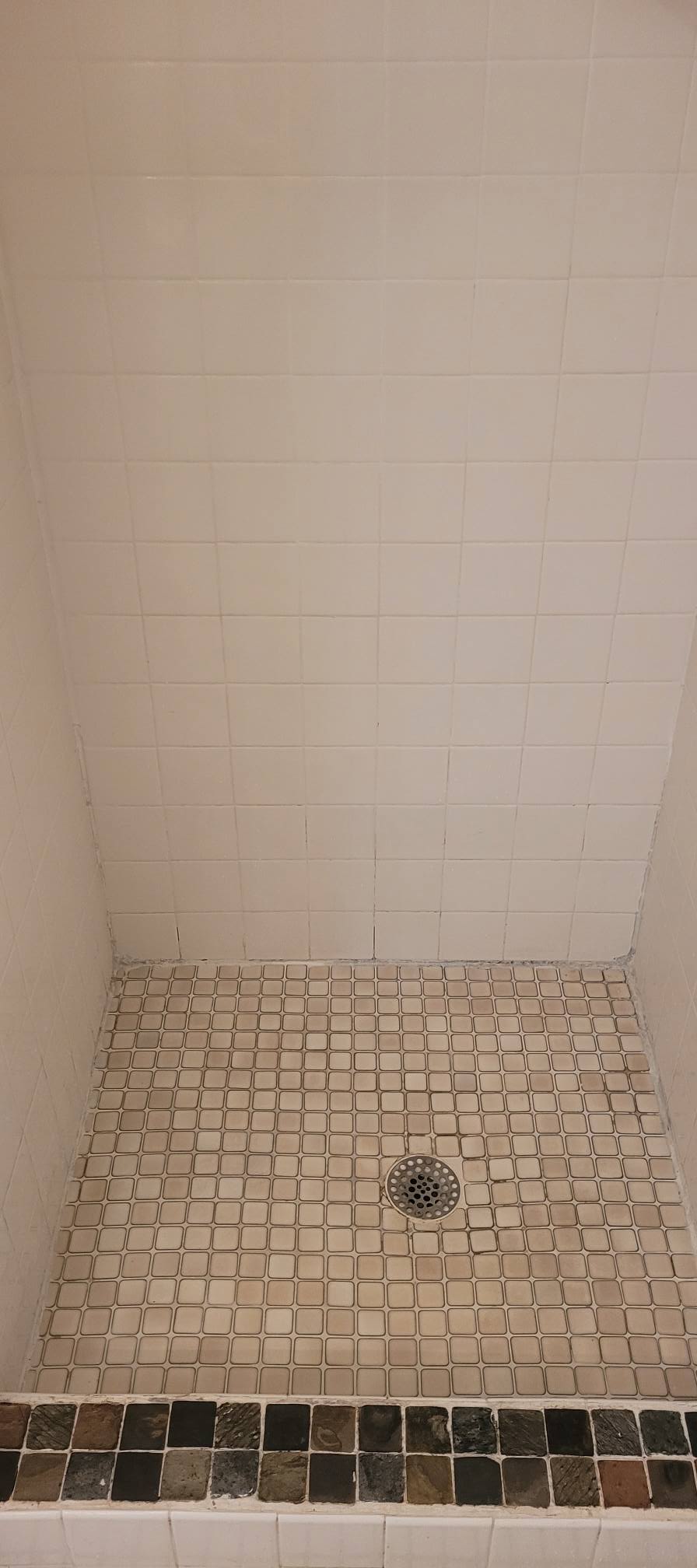 Shower tile before cleaning